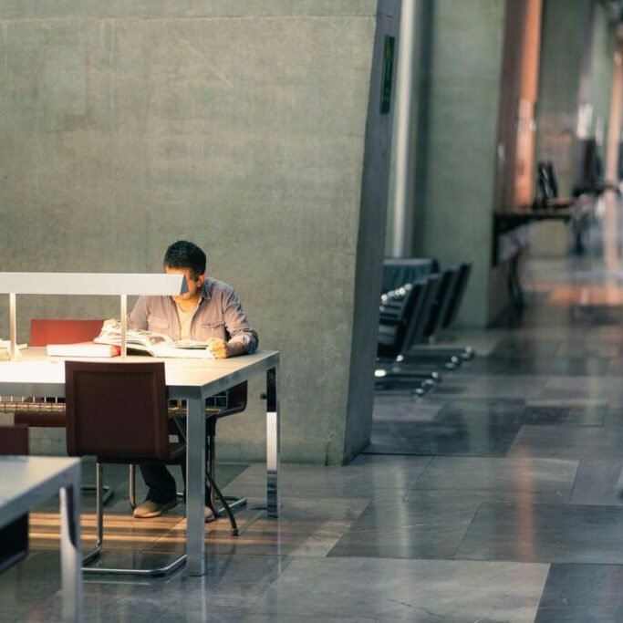 Man studying in library